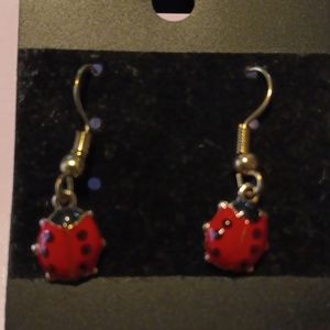 Gold tone lady bug earrings